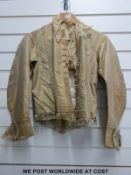 A mid Victorian skirt and jacket with lace collar and tassel decoration to the sleeves,