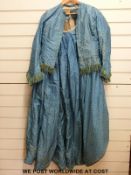 A Victorian blue silk skirt and matching jacket / bodice with green ribbon and thread trim