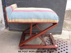 A 19thC or early 20thC gout stool with double ratchet action enabling both height and angle