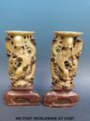 A pair of Chinese soapstone candle holders depicting figures (23cm tall)