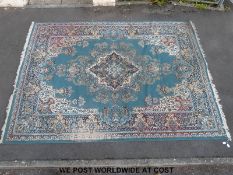 A large rug with blue ground 375cm x 278cm