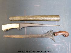 An ivory handled peshkab in a chased brass sheath (length overall 47cm) together with a bugis keris