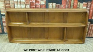 An Ercol light elm plate rack (W106cm)