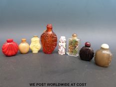 A collection of scent bottles to include hardstone examples,