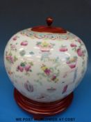 A 19th / 20thC Chinese famille rose ginger jar with wooden lid and stand (17cm tall)