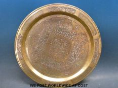 A Mamluk Revival copper and silver inlaid brass tray