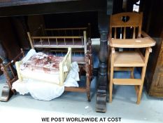 Two doll's beds with wooden ends together with a doll's bunk bed and high chair