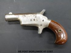 Colt .41 Derringer rimfire pocket pistol with swivel barrel (overall length 13cm).
