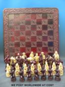 A chess set with moulded figures representing Drake and the Elizabethans against the Spanish