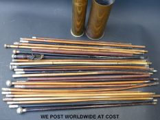 Approximately 25 military and other swagger sticks contained in two shell cases,