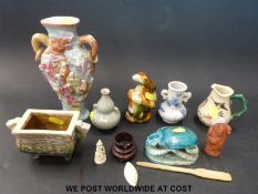 A Chinese Chien Lung vase with relief moulded figures,