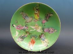 A 19thC Chinese plate with green ground and figural decoration (23.