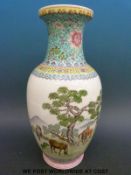A Chinese famille rose vase with landscape and animal decoration (35cm tall)