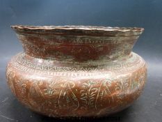 An 18thC copper Safavid Islamic copper bowl with flared rim,