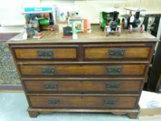 A 19thC oak and mahogany cross-banded chest of drawers raised on bracket feet (H86cm x W110cm x