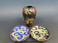 A Chinese enamel vase with a green ground and landscape decoration,