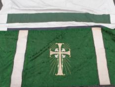 A finely embroidered altar cloth with foliate embroidery on a green ground and gold cross