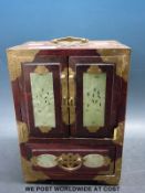 A Chinese jewellery case with carved jade / jadeite plaques and brass mounts (24cm tall)