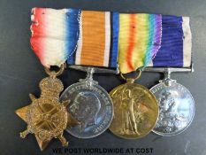 A Naval WWI group of four medals comprising 1914-15 star marked K12058 T.W.Reeves Act.L.Sto.