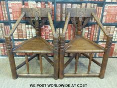 A pair of oak Warwick Watchman's chairs (87cm tall)