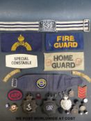 A collection of WWII civilian, police and Home Guard badges including Kent, Metropolitan,