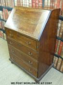 A 19thC mahogany bureau with fitted interior raised on bracket feet (W71 x D47 x H107cm)