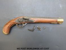 A replica flintlock hammer action pistol