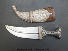 A Middle Eastern jambiya dagger with inlaid horn handle,