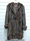 A ladies three quarter length fur coat