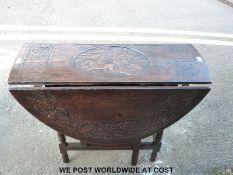 A late 18thC / early 19thC carved oak table with central roundel decorated with a Roman emperor on