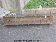 A small cast iron pig trough