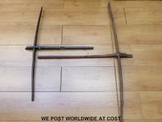 Two 19thC Fang tribe or Bantu West African crossbows, one with bone catch (largest 84cm long,