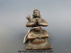 An Indian bronze figure of a Hindu saint (8.