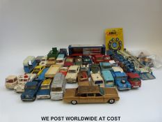 Thirty two Corgi toys diecast model vehicles together with a set of Corgi 'Golden Jacks' tyres,