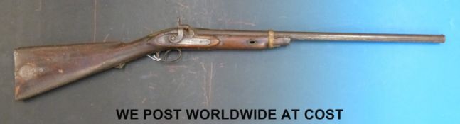 Enfield style percussion hammer action gun with ornate engraving, lock stamped VR 1861,