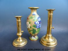 Two brass ejector candlesticks and a cloisonné vase with floral and butterfly decoration (23cm