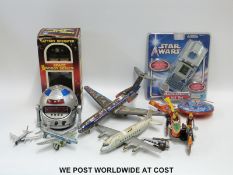 A German tin plate Capital N7402 aeroplane together with various tin plated toys battery operated