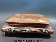 A large rectangular 18thC / 19thC Chinese carved hardwood stand (length 36cm)