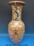 A large 19thC Chinese vase with brown crackle glaze ground decorated with multi coloured clouds and