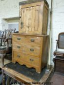 A 19thC pine table raised on turned legs together with a chest of drawers and a pine cupboard (H75