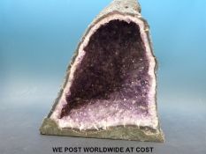 A large amethyst quartz geode (approximately 32cm tall, 26cm wide, weight 12.
