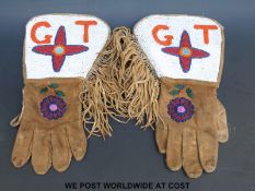 A pair of native American beaded gloves