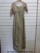 A late Georgian /early Victorian satin dress with embroidered flowers and foliate decoration to the