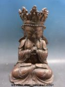 A Chinese seated figure with six character mark to back and gilt decoration (33cm tall)