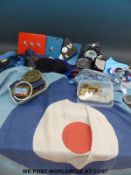 A selection of modern militaria including pennants, caps, badges, star plates,