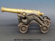 A brass and cast iron cannon