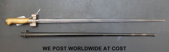 An 1886/15 pattern French stick bayonet with 52cm cruciform blade stamped C8p with brass handle