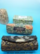 A soapstone seal depicting a fox in Liberty case,