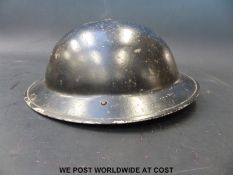 A civilian WWII black helmet.