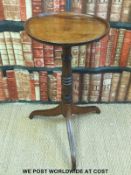 A 19thC elm or ash topped moulded circular wine table raised on tripod base (diameter 41 x H75cm)